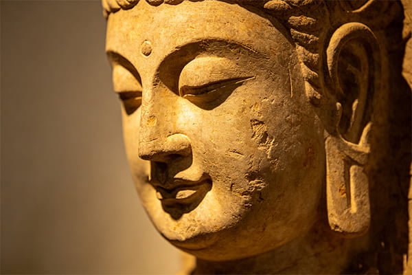 Warm, subtle lighting on a stone carving